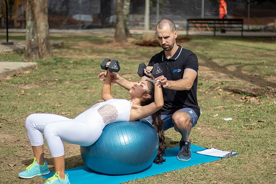 Person performing a dumbbell chest press